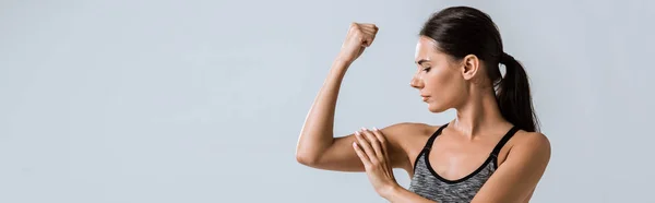 Panoramic Shot Attractive Sportswoman Touching Muscle Isolated Grey — Stock Photo, Image