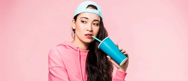 Panoramic Shot Pensive Asian Woman Pullover Cap Drinking Plastic Cup — Stock Photo, Image