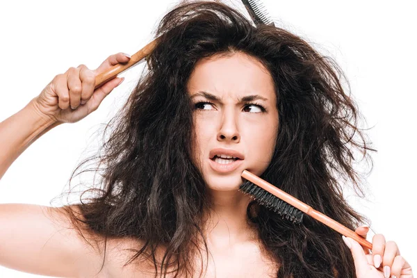 Confused Brunette Woman Combs Wavy Unruly Hair Looking Away Isolated — Stock Photo, Image