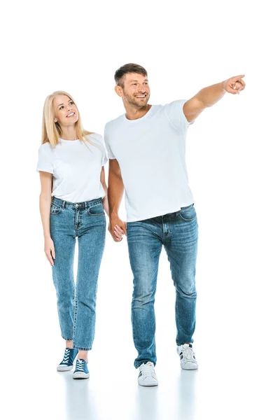 Hombre Feliz Cogido Mano Con Mujer Señalando Con Dedo Blanco — Foto de Stock