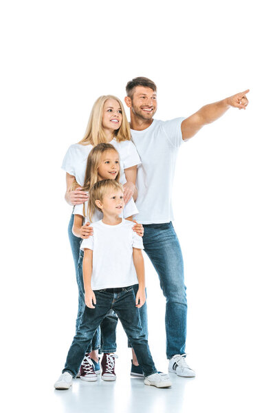 happy man pointing with finger near kids and wife on white 