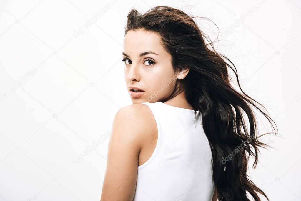 brunette beautiful woman with long healthy and shiny hair isolated on white