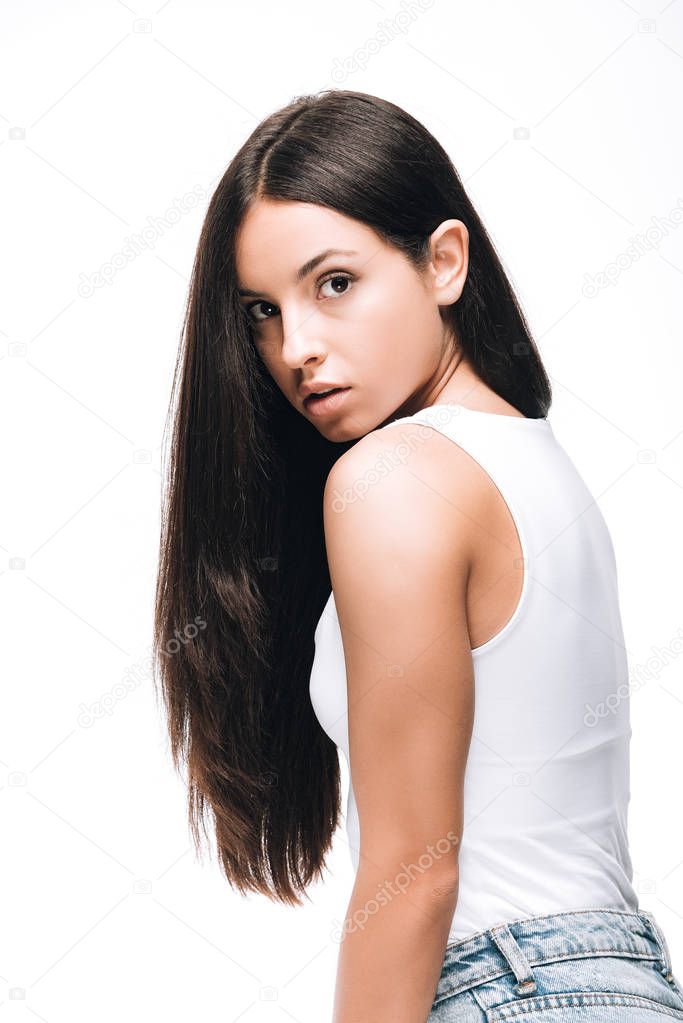 side view of brunette beautiful woman with long straight healthy and shiny hair isolated on white