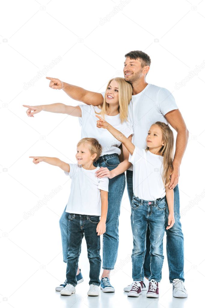 happy parents and kids pointing with fingers and looking away on white
