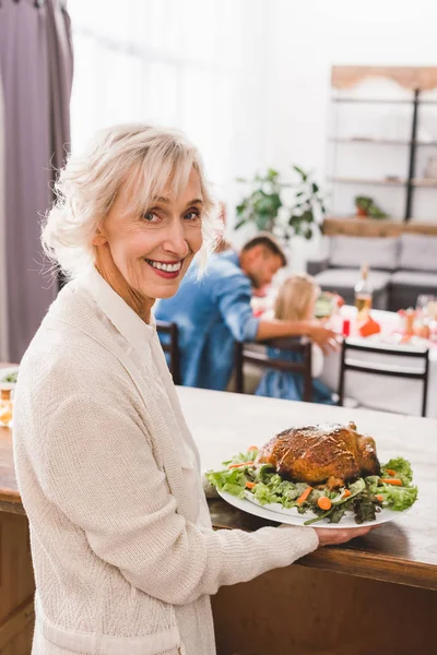 Smiling Grandmother Holding Plate Turkey Thanksgiving Day — Stock Photo, Image