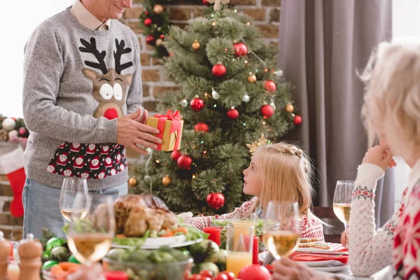 Cropped View Grandfather Giving Christmas Gift His Granddaughter — Stock Photo, Image