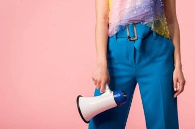 cropped view of young stylish disco girl with megaphone isolated on pink clipart