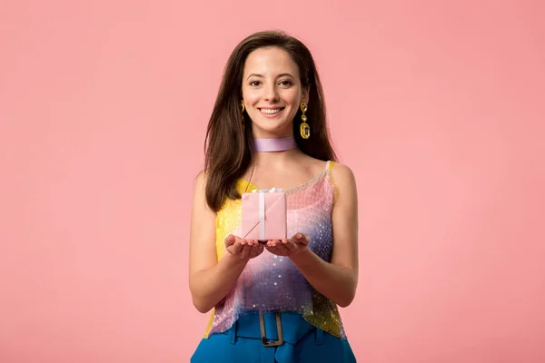 Happy Young Stylish Disco Girl Holding Gift Box Isolated Pink — ストック写真