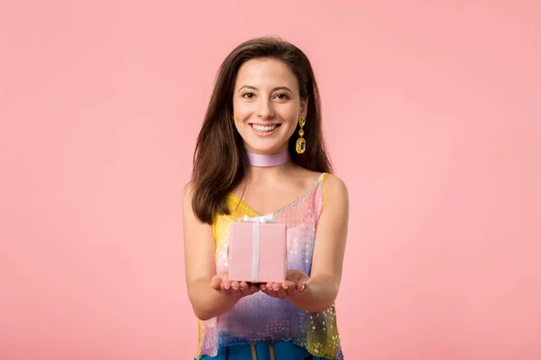 Happy Young Stylish Disco Girl Holding Gift Box Isolated Pink — ストック写真