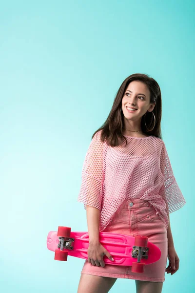 Happy Girl Pink Outfit Penny Board Looking Away Isolated Turquoise — Stock Photo, Image