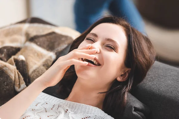 Happy Girl Laughing Lying Sofa — Stock Photo, Image