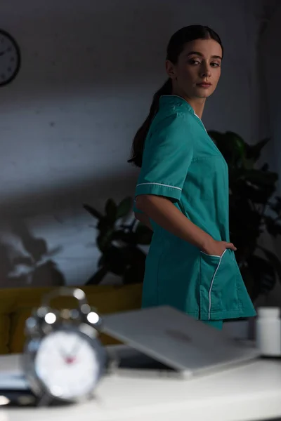 Selective Focus Attractive Nurse Uniform Looking Away Night Shift — Stock Photo, Image