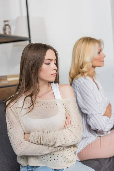 Selected Focus Offended Girl Upset Mother Sitting Sofa Crossed Arms — Stock Photo, Image