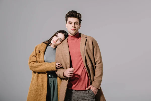 Beautiful Stylish Couple Hugging Beige Coats Isolated Grey — Stock Photo, Image