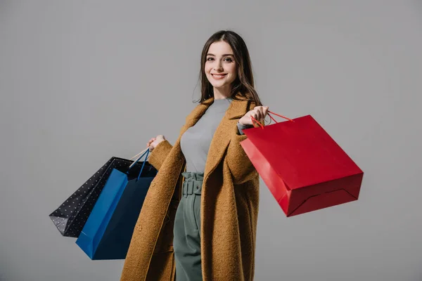 Attractive Happy Woman Beige Coat Holding Shopping Bags Isolated Grey — Stock Photo, Image