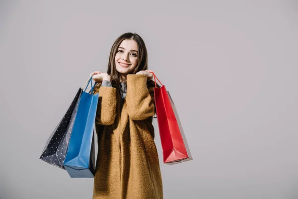 Stylish Smiling Girl Beige Coat Holding Shopping Bags Isolated Grey — Stock Photo, Image