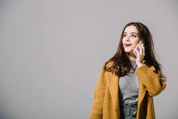 Smiling Woman Beige Coat Talking Smartphone Isolated Grey — Stock Photo, Image