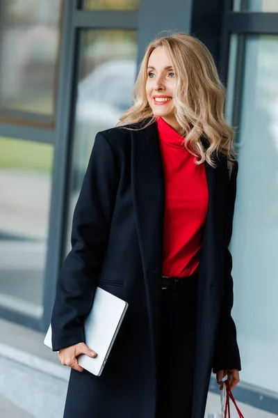 Attractive Businesswoman Black Coat Smiling Holding Laptop — Stock Photo, Image