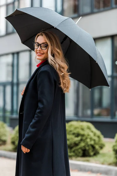 Attractive Smiling Businesswoman Black Coat Holding Umbrella — Stock Photo, Image