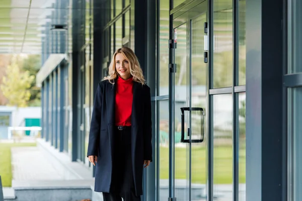 Attractive Smiling Businesswoman Black Coat Looking Away — Stock Photo, Image