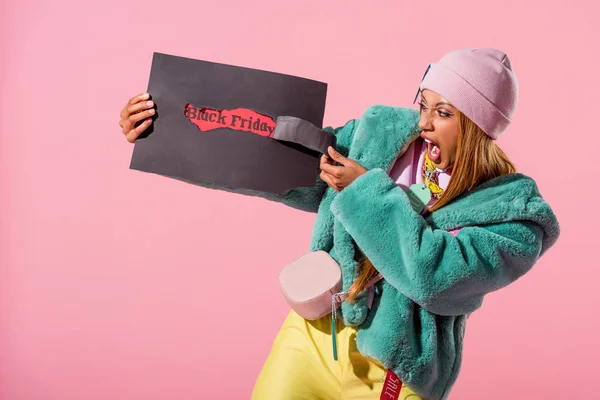 Excited Trendy African American Woman Tearing Paper Black Friday Inscription — Stock Photo, Image