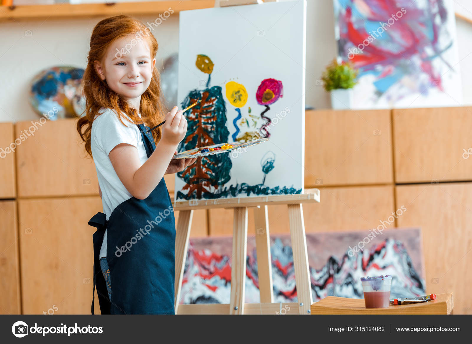 Happy Redhead Kid Painting Canvas Art School Stock Photo by ©AndrewLozovyi  315124082