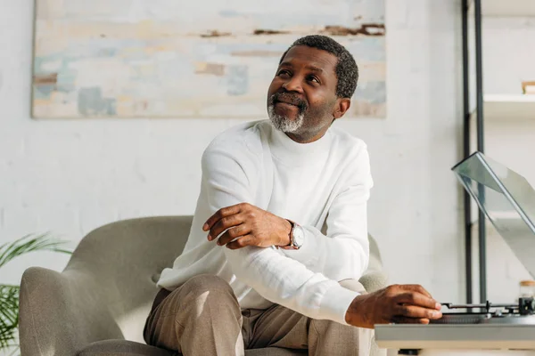 Smiling African American Man Looking Away While Listening Music Record — Stock Photo, Image