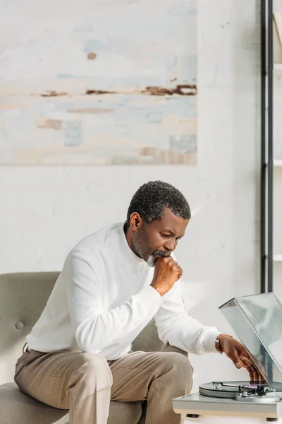 Senior African American Man Sitting Armchair Listening Music Record Player — Stock Photo, Image