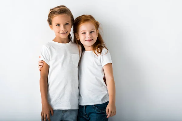 Cheerful Kids Hugging While Standing White — Stock Photo, Image
