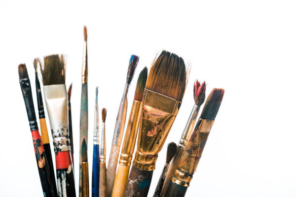 selective focus of paintbrushes isolated on white 