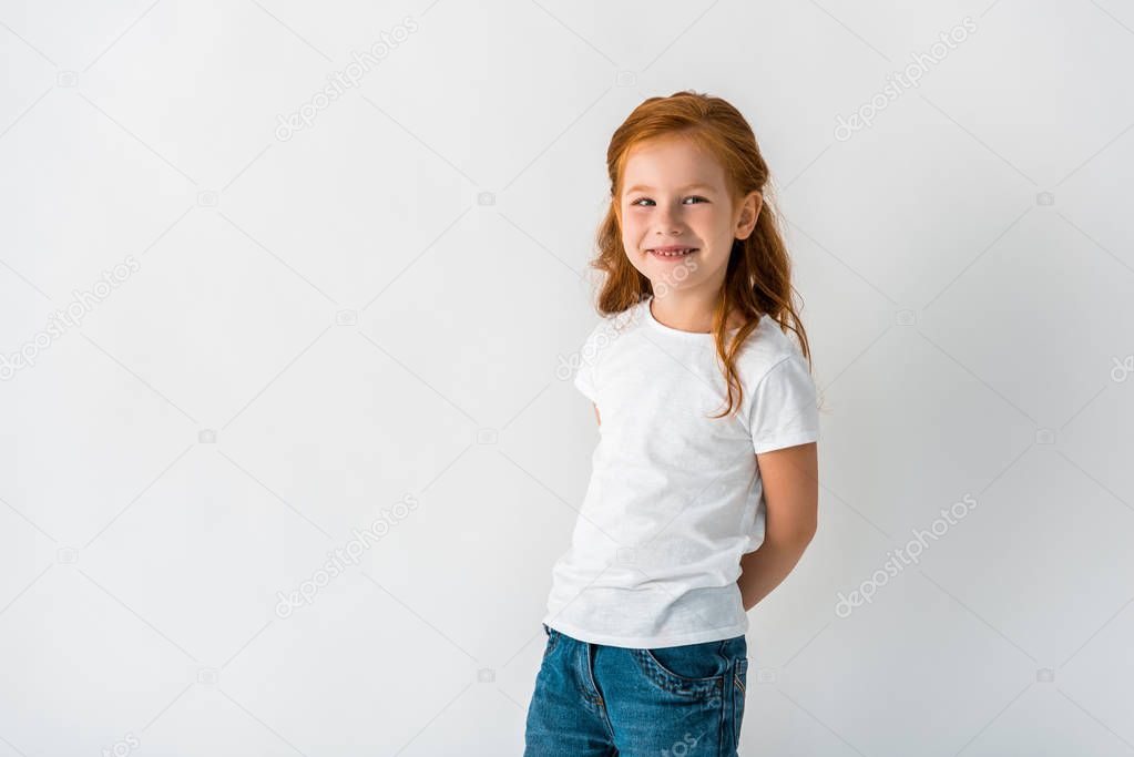 happy redhead child smiling isolated on white 