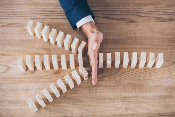 Cropped View Risk Manager Protecting Wooden Blocks Domino Effect — Stock Photo, Image
