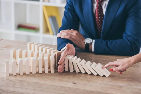 Cropped View Woman Pushing Wooden Block Risk Manager Stopping Domino — Stock Photo, Image