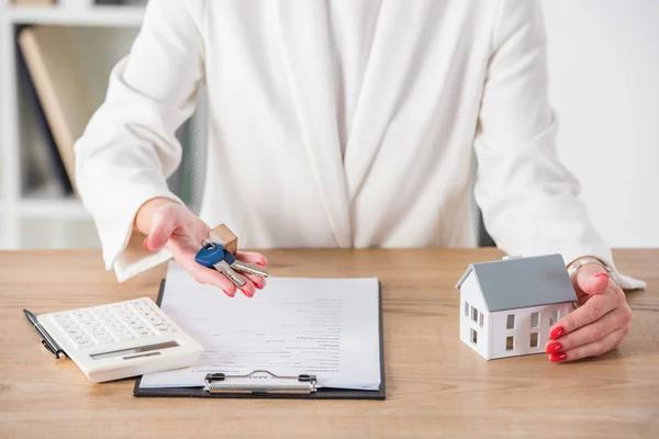 Partial View Businesswoman Workplace Holding Keys Touching House Model Clipboard — Stock Photo, Image