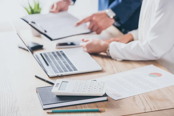 Cropped View Businessman Pointing Finger Clipboard Colleague Sitting Workplace — Stock Photo, Image