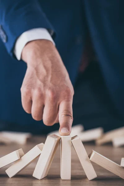 Partial View Risk Manager Stopping Domino Effect Falling Wooden Blocks — Stock Photo, Image