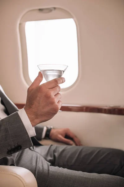 Cropped View Businessman Holding Martini Glass Drink Private Jet — ストック写真