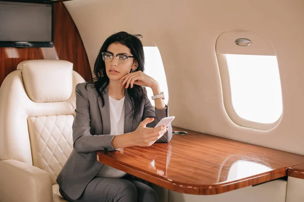 Businesswoman Glasses Using Smartphone Private Jet — Stock Photo, Image