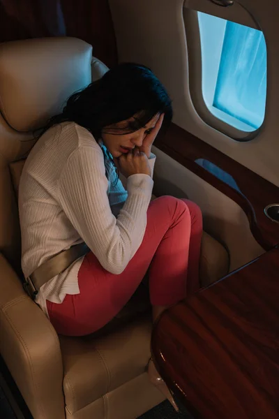 Overhead View Scared Woman Airsickness Sitting Private Jet — Stock Photo, Image