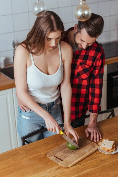 High Angle View Attractive Girl Cutting Fresh Avocado Handsome Boyfriend — Stock Photo, Image