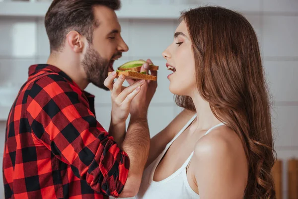 Side View Young Couple Eating Toasts Fresh Avocado — Stock Photo, Image