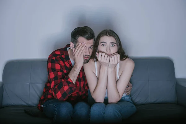 Scared Man Covering Eye Hand While Watching Movie Frightened Girl — Stock Photo, Image