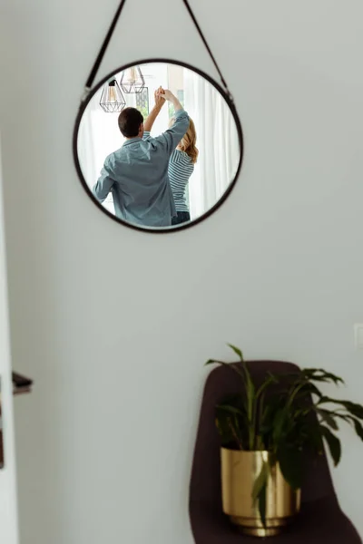 Selective Focus Mature Couple Reflecting Mirror While Dancing Home — Stock Photo, Image