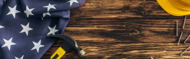 panoramic shot of american flag and instruments near safety helmet on wooden surface, labor day cocnept clipart