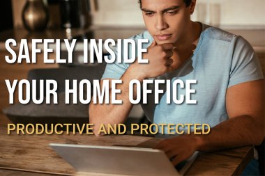 thoughtful mixed race freelancer looking at laptop near safely inside your home office, productive and protected lettering clipart