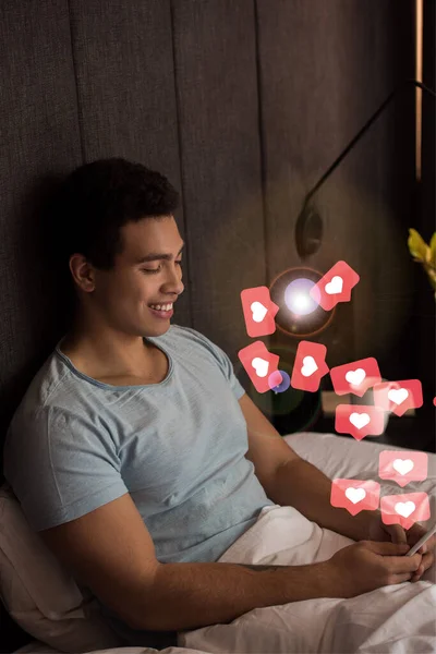 Happy Mixed Race Man Using Smartphone Virtual Hearts Bedroom — Stock Photo, Image