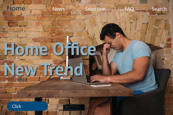 stressed mixed race freelancer near computers and home office new trend lettering 