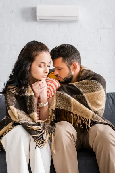 Handsome Man Sitting Girlfriend Wrapped Plaid Couch Living Room — Stock Photo, Image