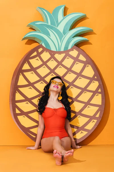 Cheerful Barefoot Woman Swimsuit Sunglasses Sitting Paper Cut Pineapple Orange — Stock Photo, Image