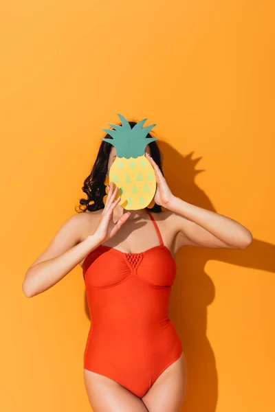 Young Woman Swimsuit Covering Face Paper Cut Pineapple Orange — Stock Photo, Image